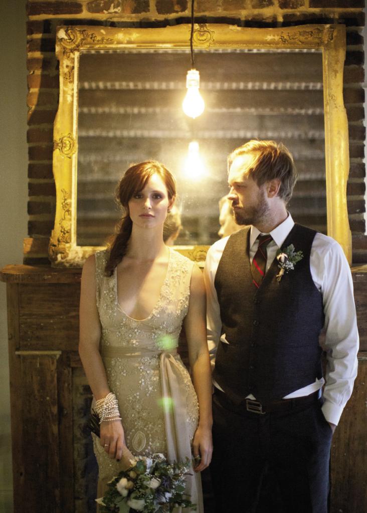 KEEP IT SIMPLE: Exposed lightbulbs and rustic wooden elements helped lend the evening its old-timey feel. The bride wore a gown from local designer Rachel Gordon. (above)