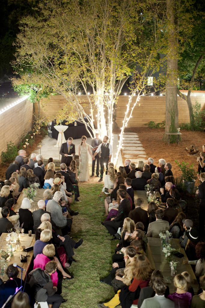 IN THE SPOTLIGHT: Bright bulbs gave the backyard a whimsical glow. A few strands were spiraled up the orange tree, focusing due attention on the newlyweds-to-be.