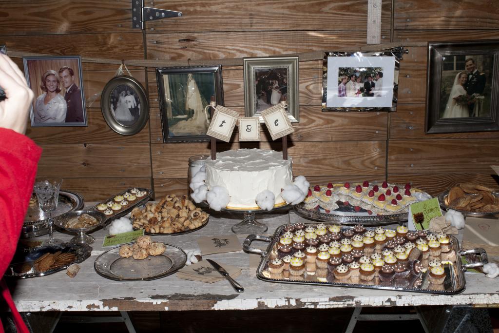 WHAT A SPREAD: In the spirit of intimacy, the couple used only silver hand-me-downs as serving dishes. The cake, baked by Twenty Six Divine, was complemented by smaller treats from local bakeries, like Saffron Café and Bakery.