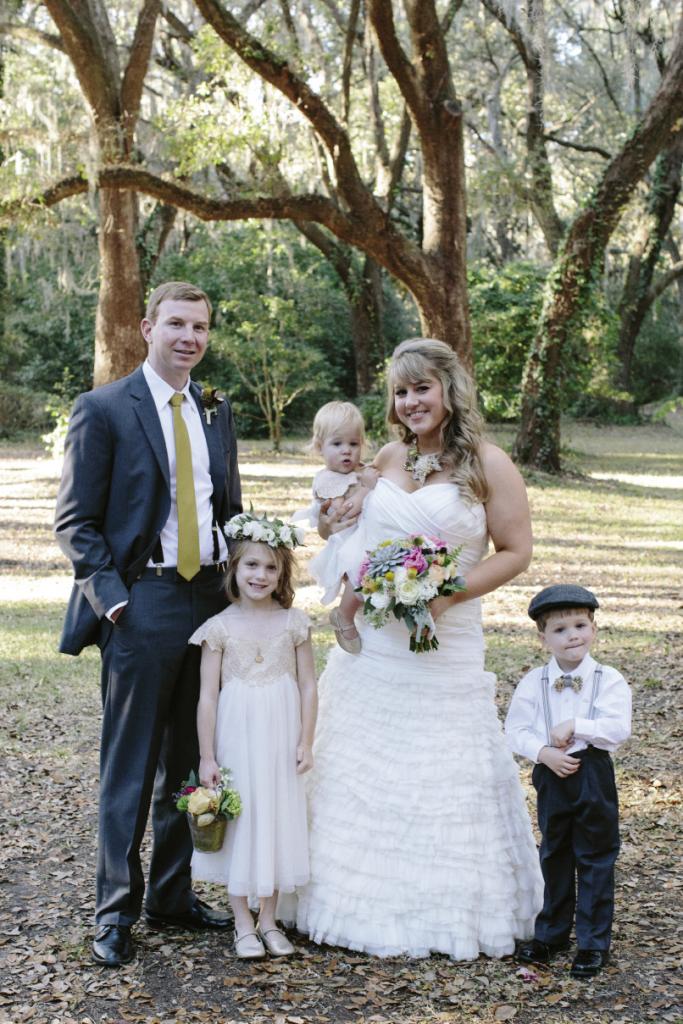 KIDDIE COUTURE: Flower girl Sophie looked idyllic in her Estella dress from Monsoon, while ring bearer Sammy wore a J.Crew cap and H&amp;M suspenders. Sarah donned a Modern Trousseau gown, and Chris wore a suit from Berlin’s for Men.