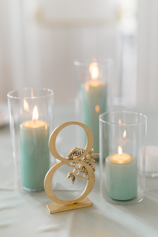 Favors were candles that smelled like the beach so guests would be reminded of the wedding when they light them.