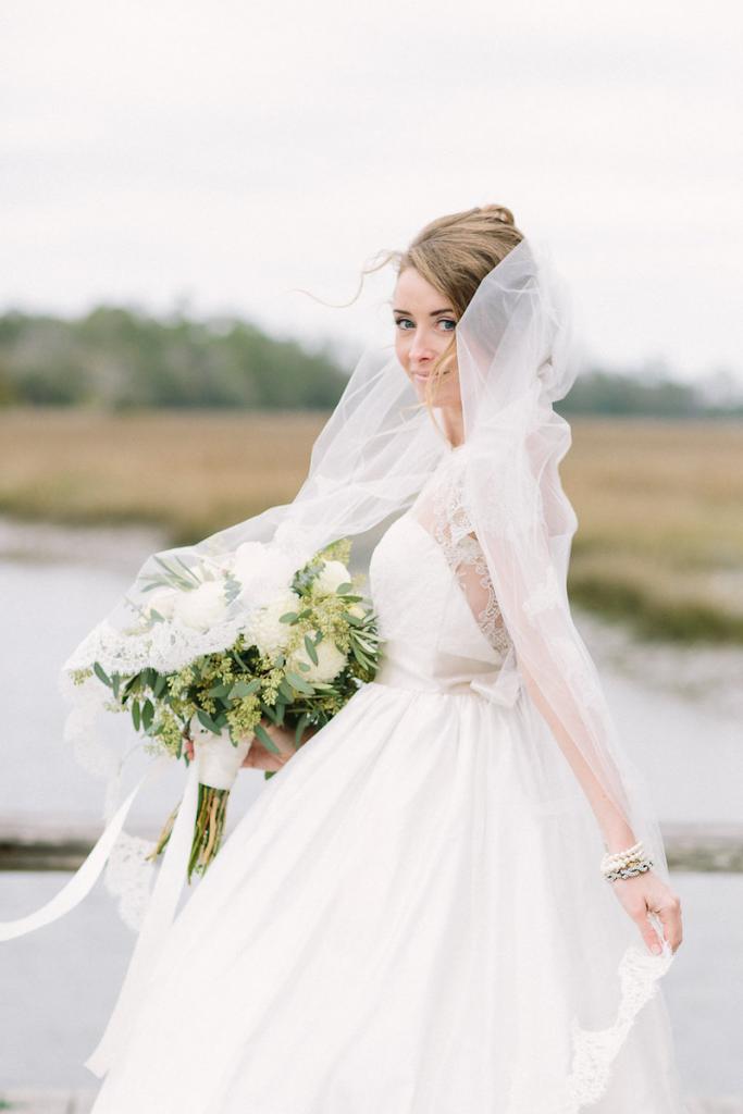 Bride&#039;s gown by Tara Keely. Florals by Lauren Luecke. Hair by Krystal Yangco. Image by Julia Wade Photography at Boone Hall Plantation.