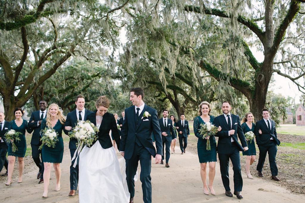 Bride&#039;s gown by Tara Keely. Bridesmaids&#039; dresses by Adrianna Papell (available locally at Bella Bridesmaids). Florals by Lauren Luecke. Image by Julia Wade Photography at Boone Hall Plantation.