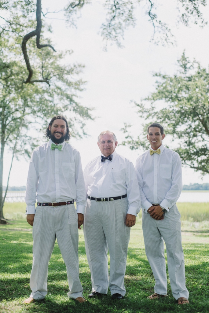 Groom and groomsmen’s suits by Hardwicks. Bow ties by Southern Proper and Bird Dog Bay. Photograph by Sean Money + Elizabeth Fay at Lowndes Grove Plantation.