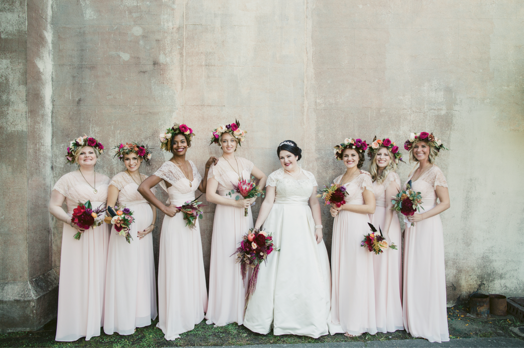 Ground-skimming pale pink dresses and golden lockets enhanced the maids’ ethereal look. (Image by Juliet Elizabeth Photography)