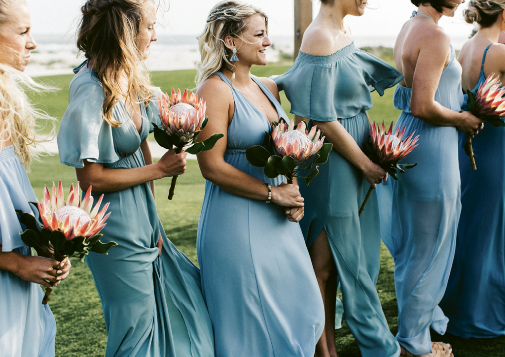 Bridesmaids carried single proteas down the aisle.