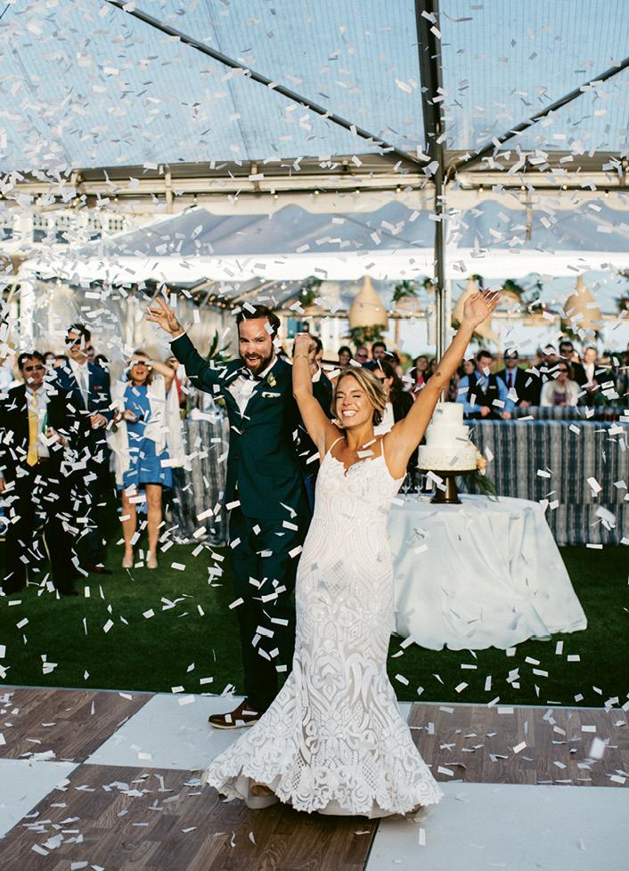 Windy conditions meant the couple couldn’t shoot confetti cannons at their ceremony as planned. Their planner surprised them by setting them off when the newlyweds were introduced at their reception