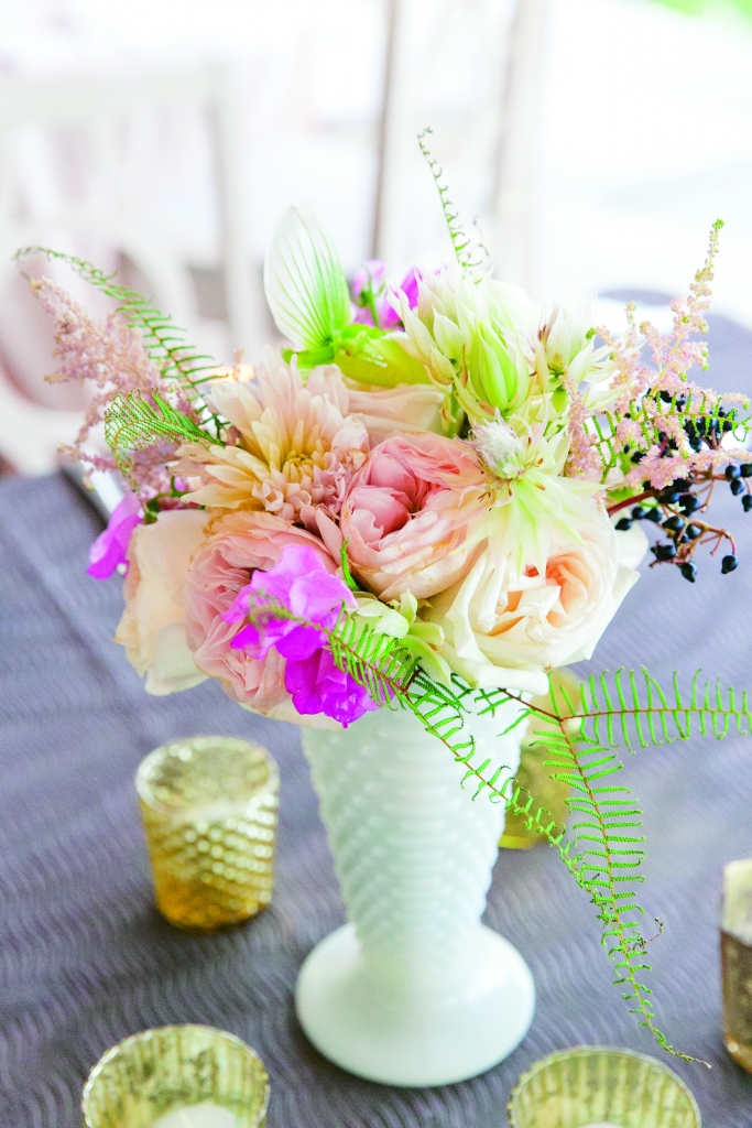 Hobnail milk glass vessels held textured blooms and greens. &lt;i&gt;Photograph by Dana Cubbage Weddings&lt;/i&gt;