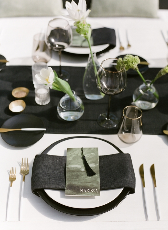 The elegant black-and-white color palette was enhanced by contemporary touches of metallic accents and geometric shapes.