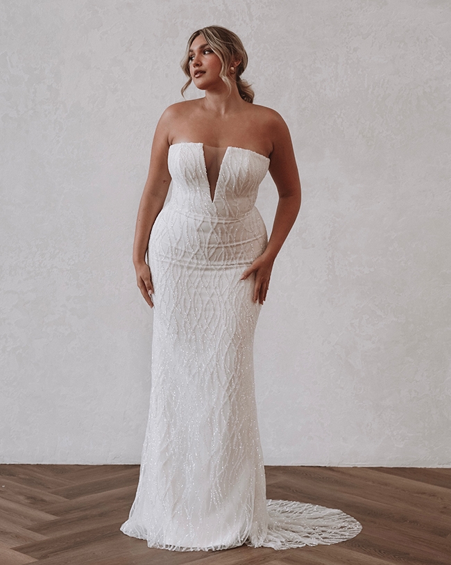 Flat-Out Glamour - “Noah” dress by Made With Love Why We Love It “A flattering, deep neckline and a flawlessly fitted silhouette”  –Nicole Brew,  Lovely Bride