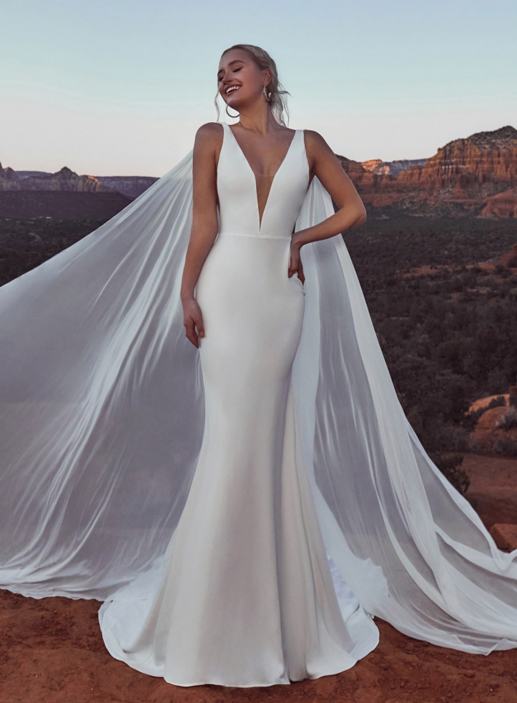 BEYOND THE VEIL - “Meadow” crepe gown and cape by Calla Blanche Why We Love It “For the bride who doesn’t love the idea of a veil and wants to be unique, a cape is a great option.”  –Jessica Kiss, Verità. A Bridal Boutique