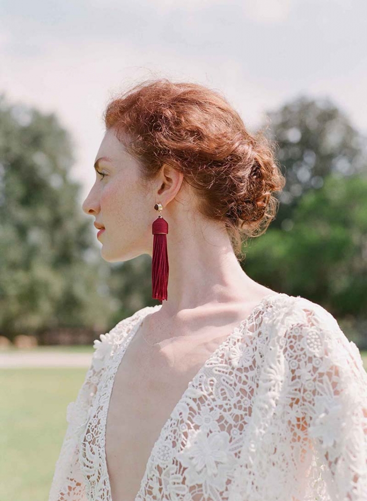 Sarah Seven’s “Milo” embroidered gown with draped sleeves and illusion V-neck from Lovely. Maroon tassel earrings from Out of Hand.   &lt;i&gt;Photograph by Corbin Gurkin&lt;/i&gt;
