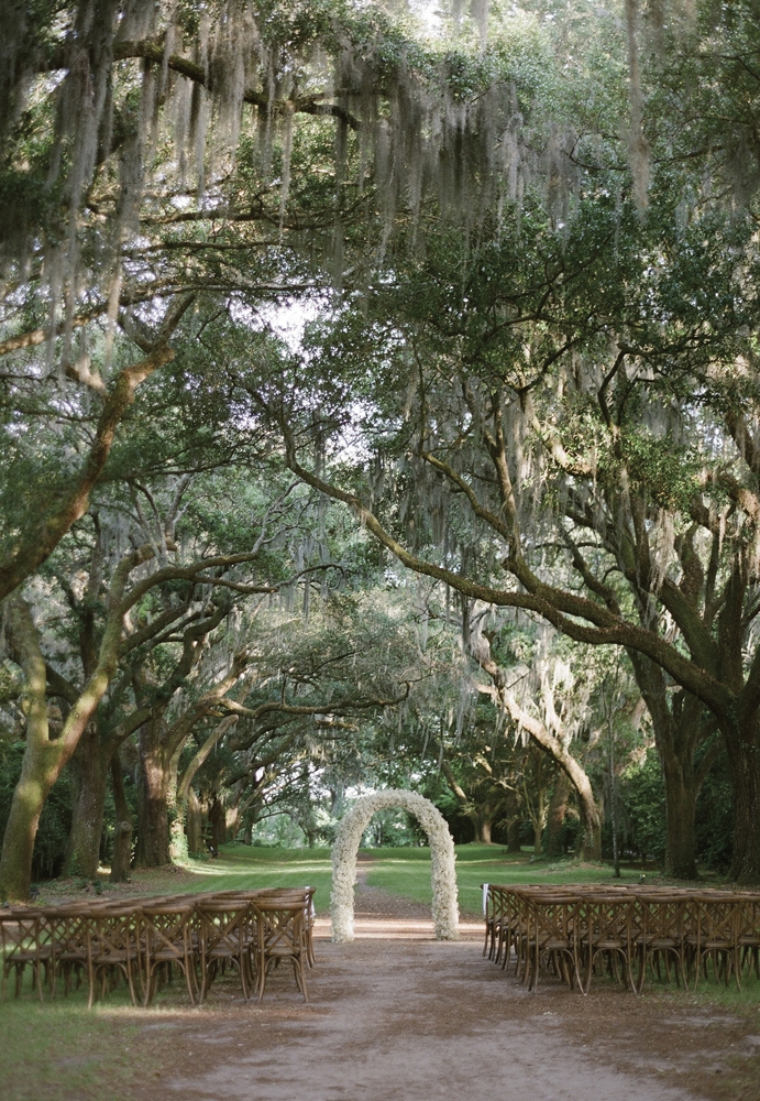 Live oaks provided the perfect backdrop for the sun-dappled ceremony.