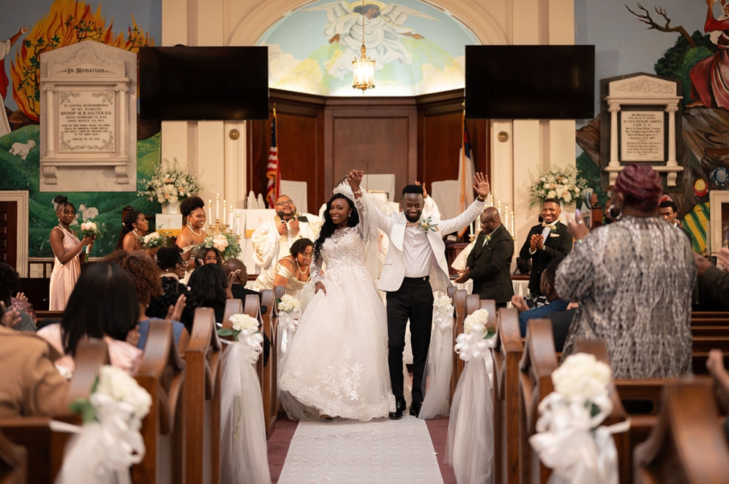 One month later, with help from planner Deborah Sanders and her assistant, Judy Sanders-Bill, the couple exchanged vows again at Morris Brown AME Church, this time with her in an Allure lace appliqué ball gown from Verità Bridal Boutique and him in a Cole Haan tux.