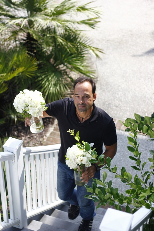 Tiger Lily Weddings owner Manny Gonzales delivering the blooms