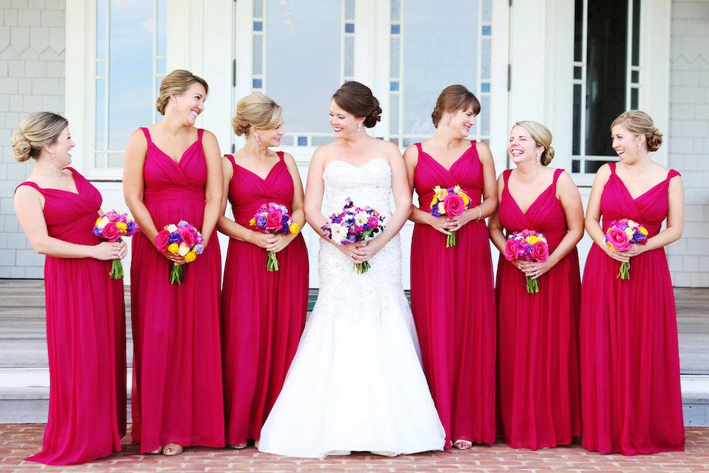 Bride&#039;s gown from Martina Liana (available locally at Gown Boutique of Charleston). Bridesmaid dresses by Donna Morgan (available locally at Gown Boutique of Charleston and Bella Bridesmaids). Image by Lindsay Collette Photography.