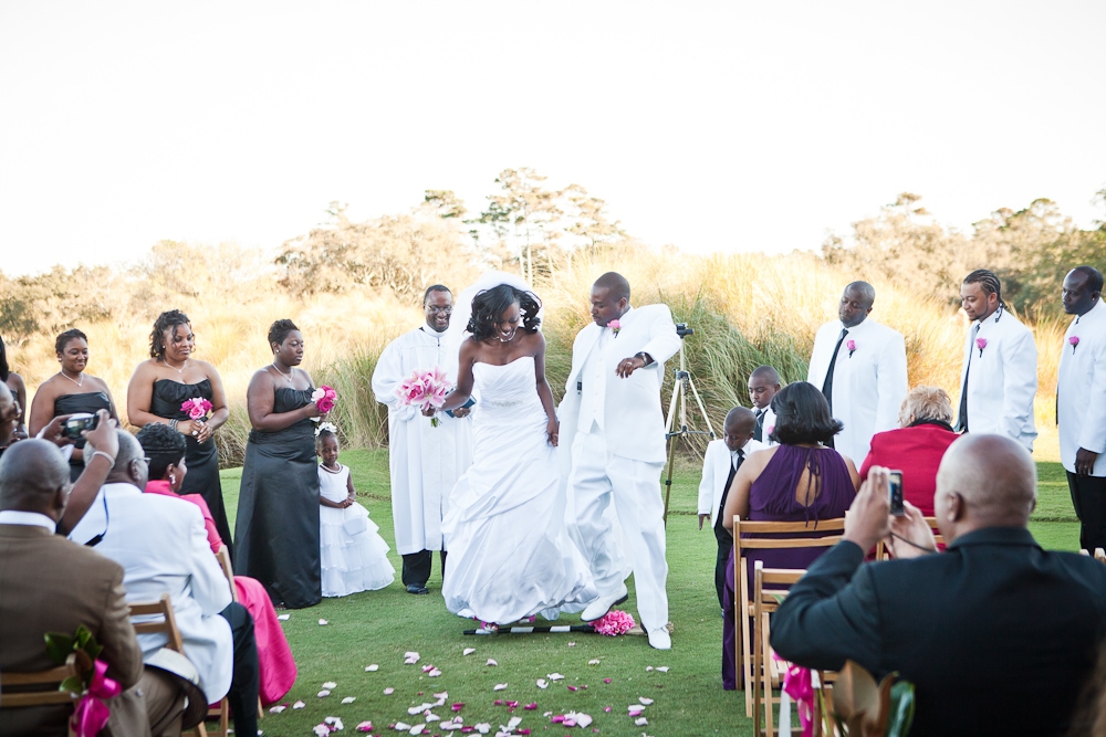 LEAP OF FAITH: Tamars and Jaime sealed their vows with the African tradition of “jumping the broom,” which symbolizes sweeping away the old and welcoming the new. The couple says their ceremony was dedicated to the memories of the bride’s father and the groom’s grandfather.