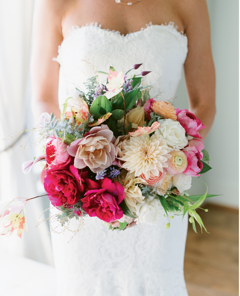 One of the bride&#039;s paintings (Folly Front) provided the palette inspiration for the wedding and for her bouquet by Stems. (Image by Natalie Franke Photography)