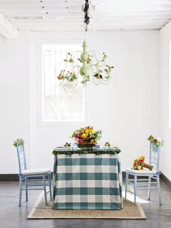 CHECK IT OUT: Large-scale checks blanket the table, and in  lieu of candles, calamondin oranges dressed the chandelier.