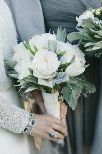 SOFT ACCENTS: A Charleston Bride’s Jonie LaRosse fashioned a classic bouquet of white roses, tulips, and lamb’s ears to complement Chloe’s shimmering bridal jacket.