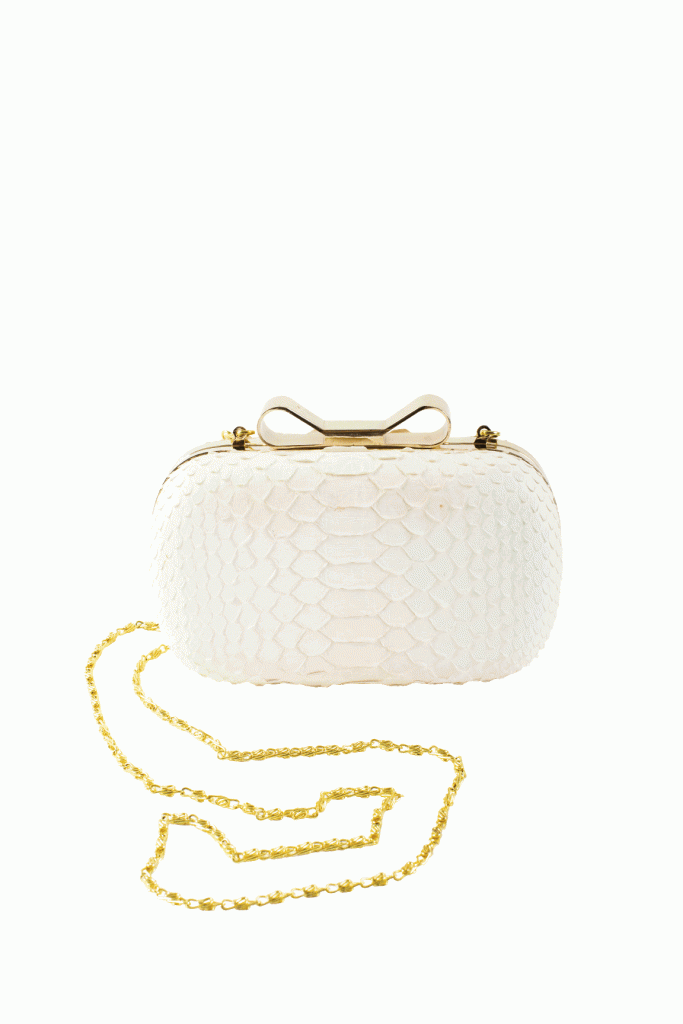 5. HOLD ONTO A CLASSY CLUTCH: Even the bride’s Taxidermy clutch adds  a little gilded touch and a dash of bleached white beachiness. (Clutch: Southern  Protocol Boutique)