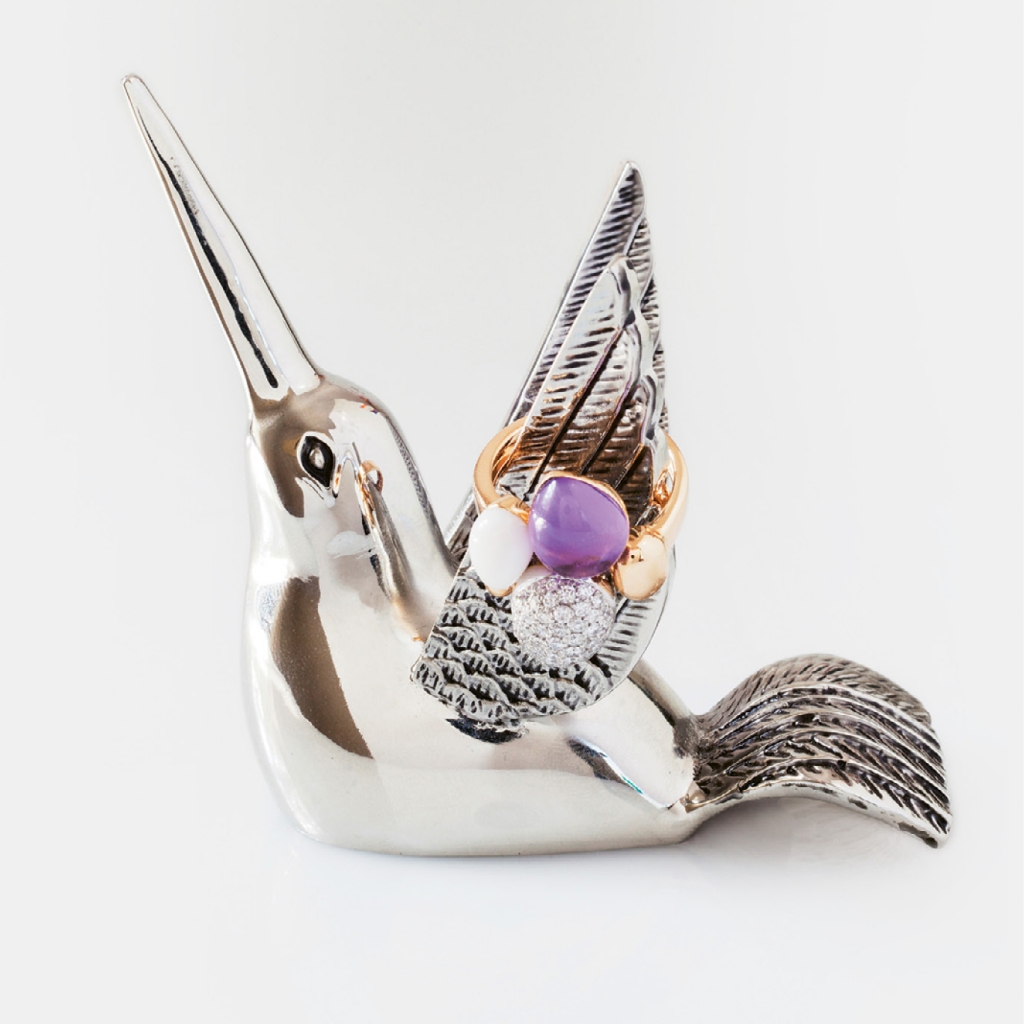 (Above) Amethyst, diamond, onyx, enamel, and gold ring ($1,840 from Roberto Coin). Hummingbird holder ($12.99 from Pottery Barn).  &lt;i&gt;Photograph Gayle Brooker&lt;/i&gt;