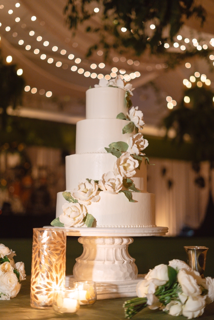 Baker Jim Smeal draped the four-layer crème caramel cake in gum paste magnolia flowers. Rich, dark greens marked everything from bridesmaids gowns and velvet table linens to lush arrangements of magnolias and evergreens.