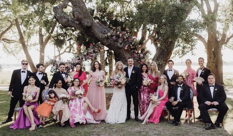 Unexpected surprises and over-the-top maximalism were the themes that threaded throughout Anna and Dylan’s Lowndes Grove wedding. The bridal party went all out with individual designer gowns, sequins, and feathers.