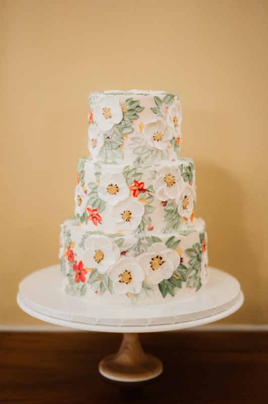 The vegan wedding cake, in alternating layers of lemon and carrot, wowed guests.
