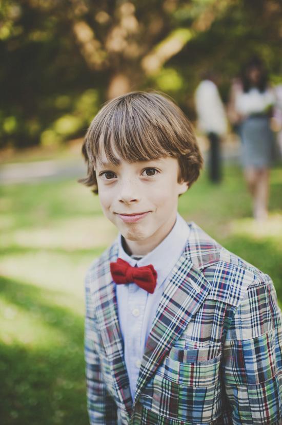 DRESS SHARP: Cousin of the bride Ellis Moore showed off a dapper plaid blazer and bright red bow tie.