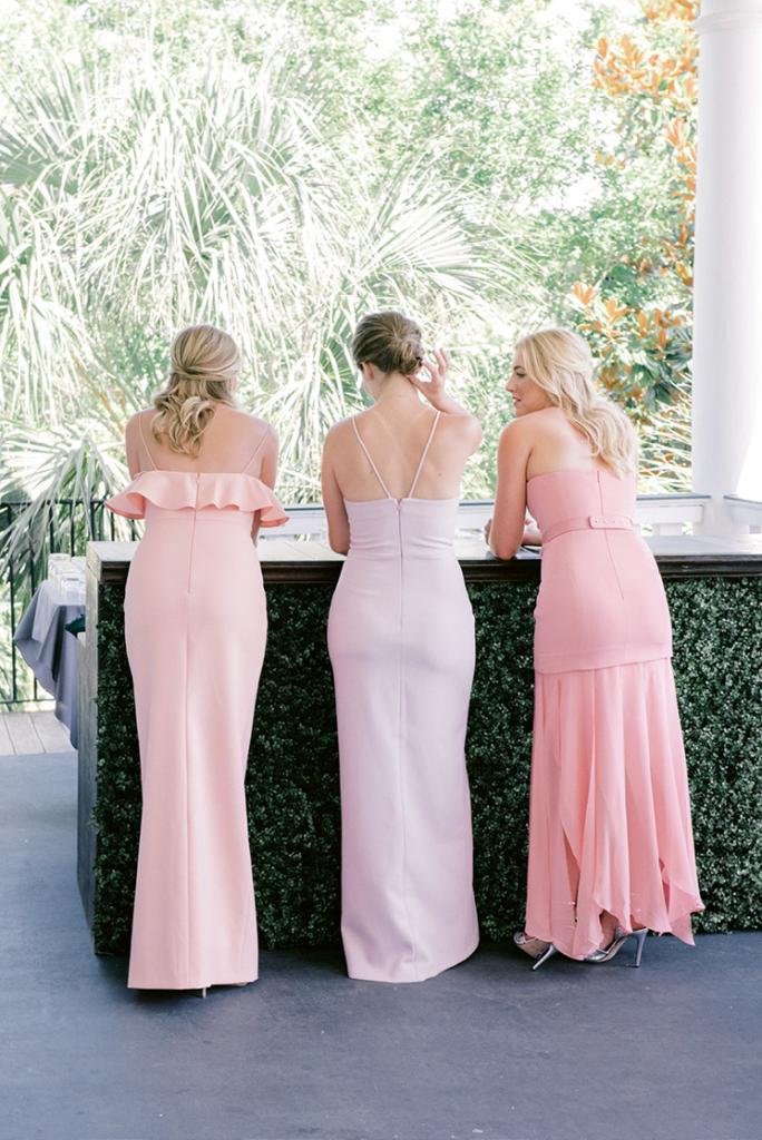 Bridesmaids acted as greeters for the guests and sat in the front row, while Taylor’s sister walked the aisle and stood with her during the ceremony. While the bridal party wore pastel gowns, the maid of honor wore a palm-print frock.
