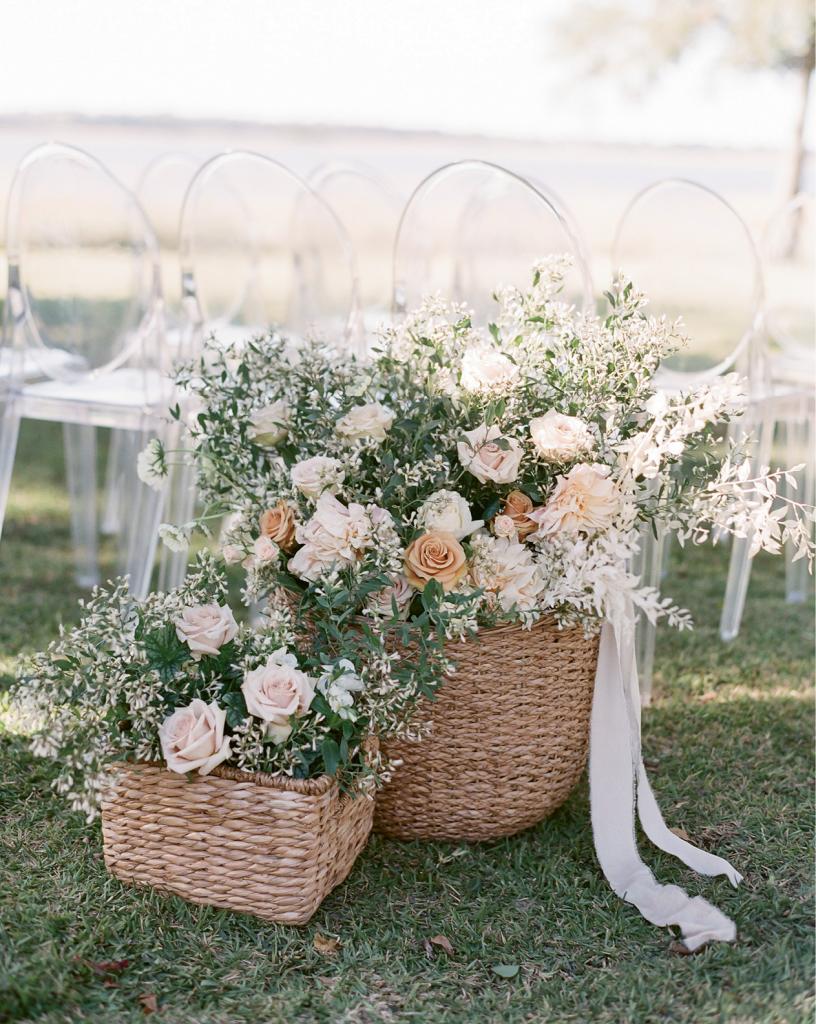 Place baskets overflowing with blooms to mark the entrance of the ceremony aisle instead of traditional markers that flank the walkway.