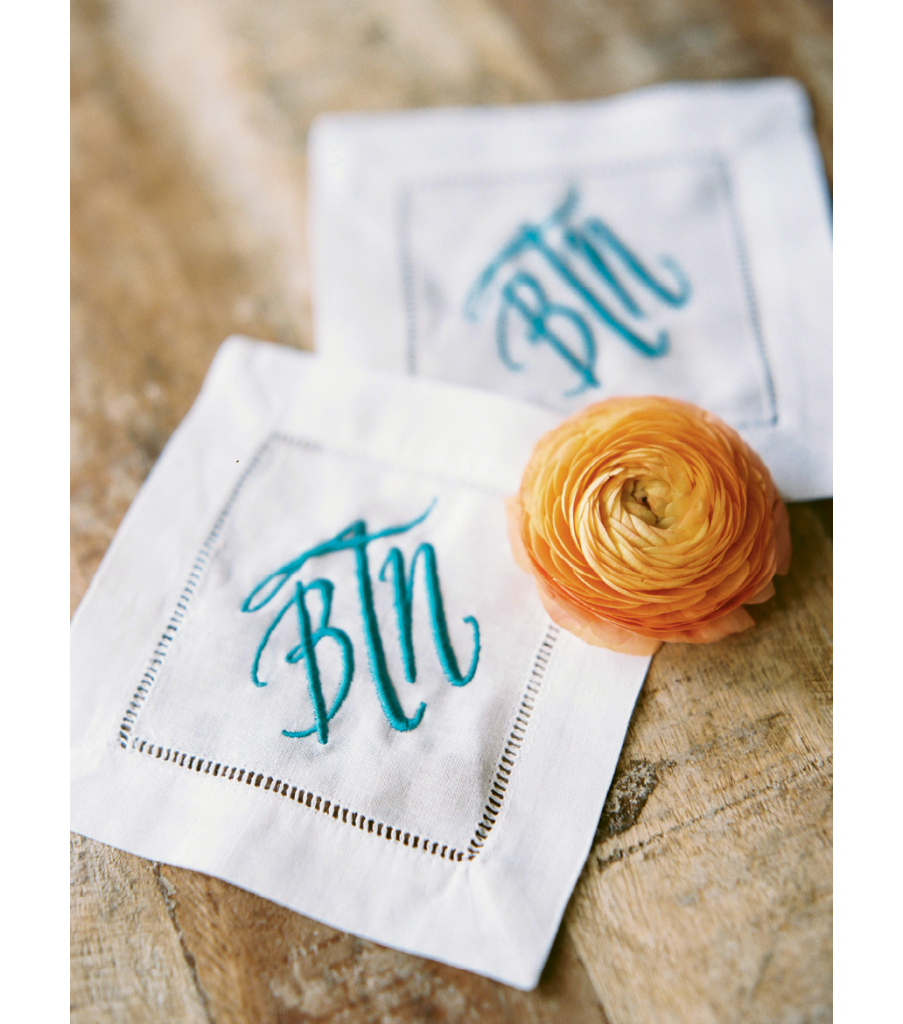 Smaller events can allow for splurges, like these monogrammed cocktail napkins the couple now uses at home. Image by Perry Vaile Photography.