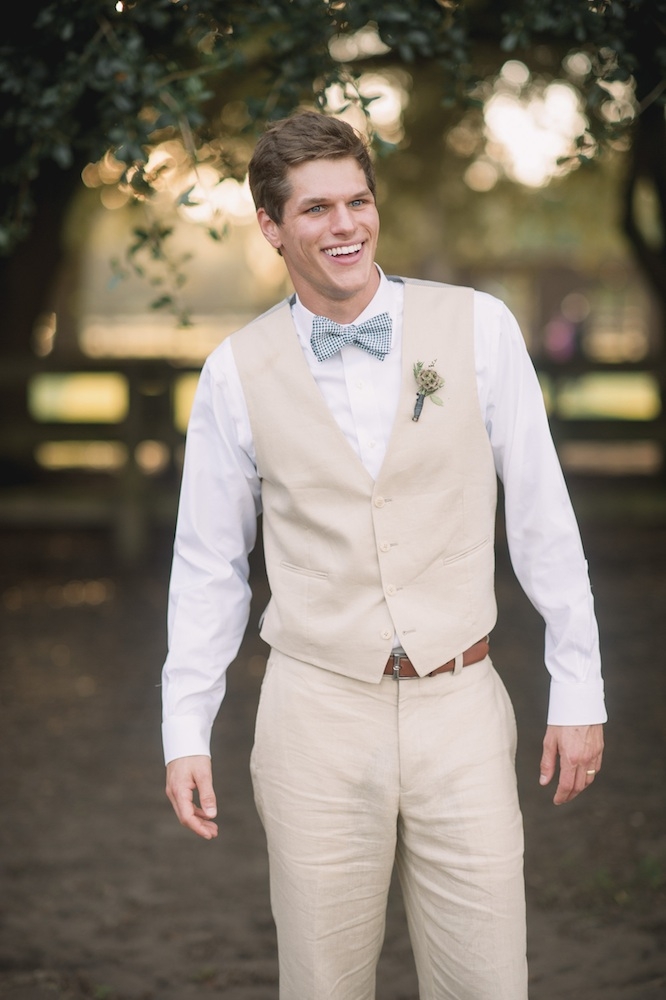 Groom&#039;s suit by Calvin Klein. Bow tie by Lilacs &amp; Company. Image by Timwill Photography at Hyde Park Farm &amp; Polo Club.