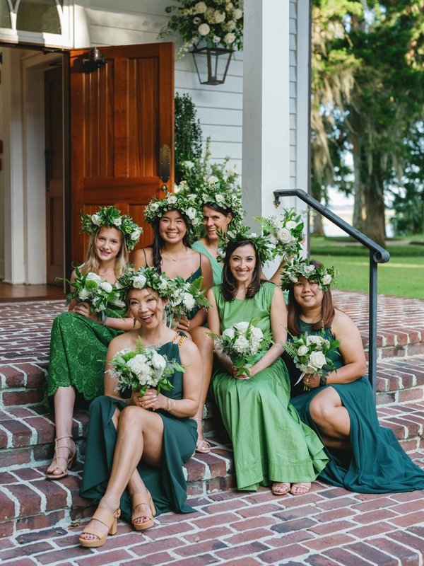 The couple’s close female friends served as flower girls, each donning a green frock and floral crown.