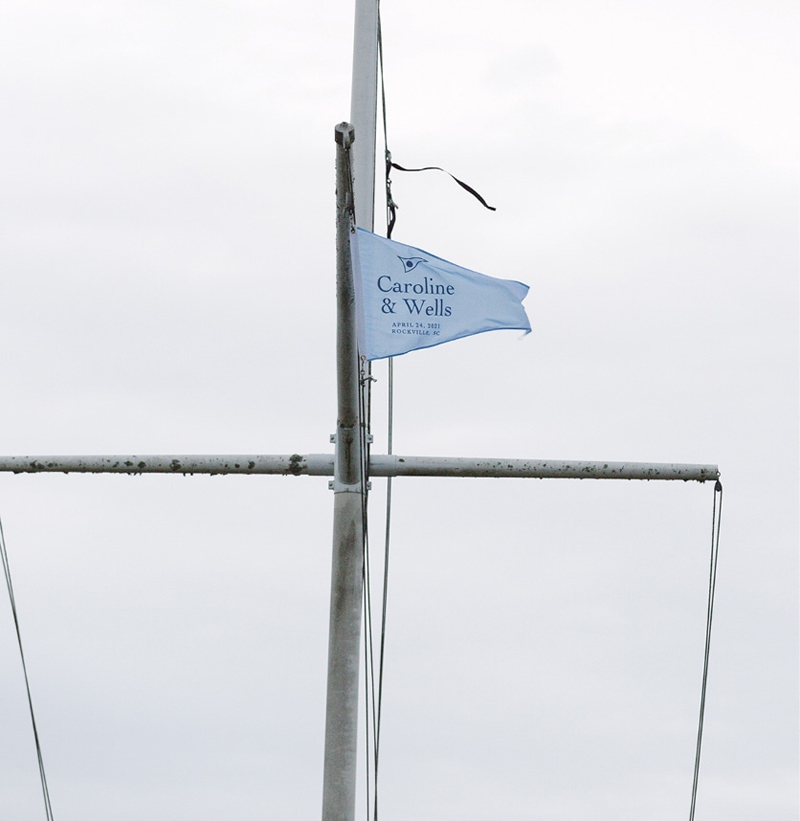 Dashes of whimsy abounded in custom sailor’s flags printed and hoisted in the couple’s honor.