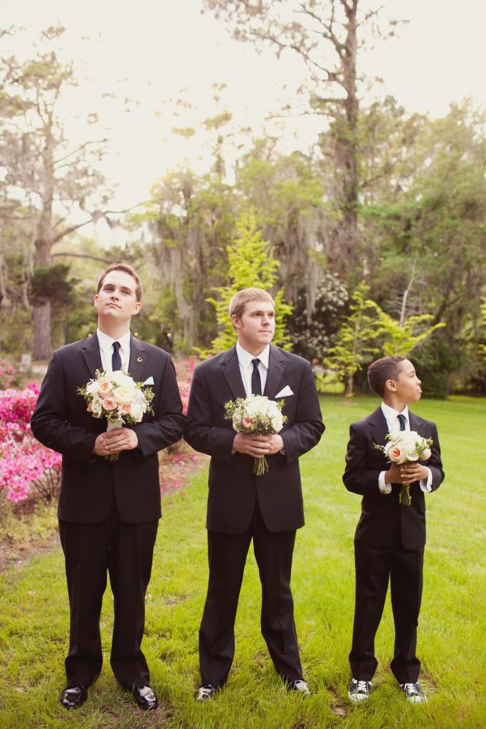 SUIT UP: The groom and his companions wore Men’s Wearhouse. Junior groomsman Gavin added age-appropriate flair to his get-up with black-and-white Converse.