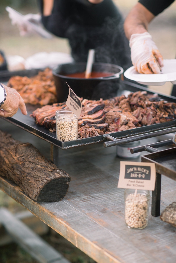 When hiring a caterer, ask  about their setup. Some are all  about Instagram-worthy iron skillets, mobile smokers, oyster roast tables, and Mason jar treats. Others are more about plastic utensil and tin warming trays. Either works  depending on your vision—and your budget. (Photo by Tim Will)