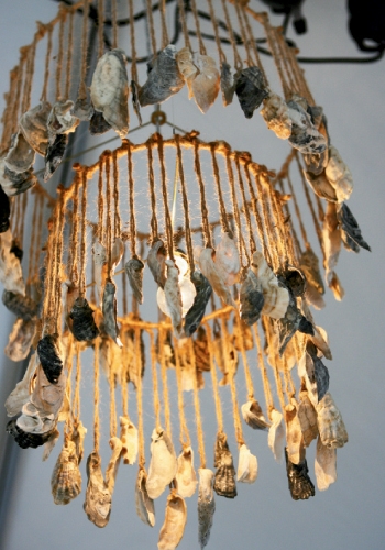 Katherine Miller and the crew at Atlantic Tent Rental strung oyster shells with twine and hung them from a chandelier frame for a touch of rustic—and relevant—elegance.