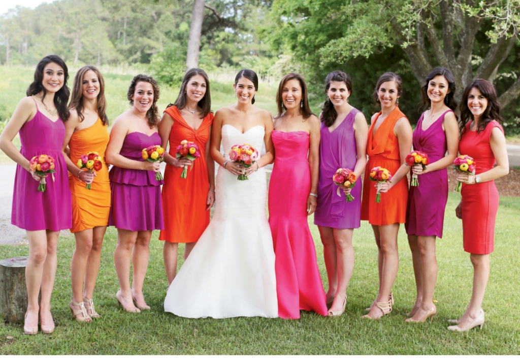 DAZZLING DAMES: Pearlann gave attendants, the maid of honor, and her mother one directive when it came to their frocks: “I asked them to choose a warm, bright color,” she says. “And it worked! I loved the look.” As for the bride?  She was radiant in a gown by Rivini.