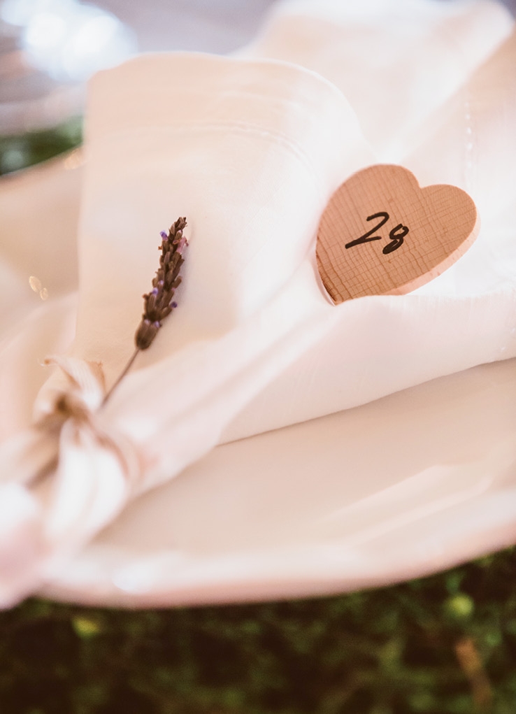 A lavender sprig and heart-shaped placeholder added romance to table settings.   &lt;i&gt;Amelia + Dan Photography&lt;/i&gt;