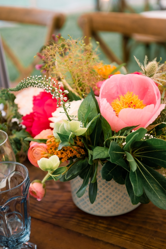 Patterned vessels held colorful combinations of garden roses, hellebores, lysimachia, orchids, peonies, and ranunculus. Says florist Anne Bowen of Charleston Stems: “Late spring brings so many options—the sky’s the limit!” &lt;i&gt;Image by Timwill Photography&lt;/i&gt;