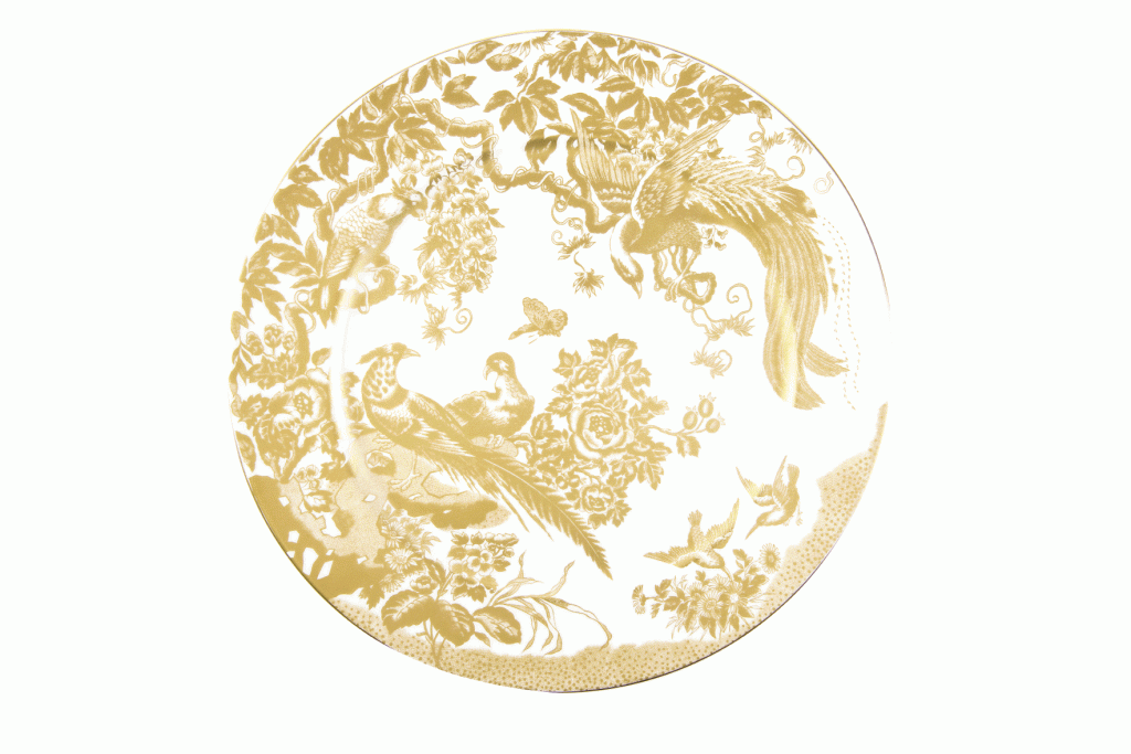 Royal Crown Derby’s “Gold Aves” Service Plate. Twenty-two karat gold painted on British bone china, this Avesbury pattern features birds of paradise and peacocks and pairs excellently with other patterns. The Boutique, $325  (12-inch plate)