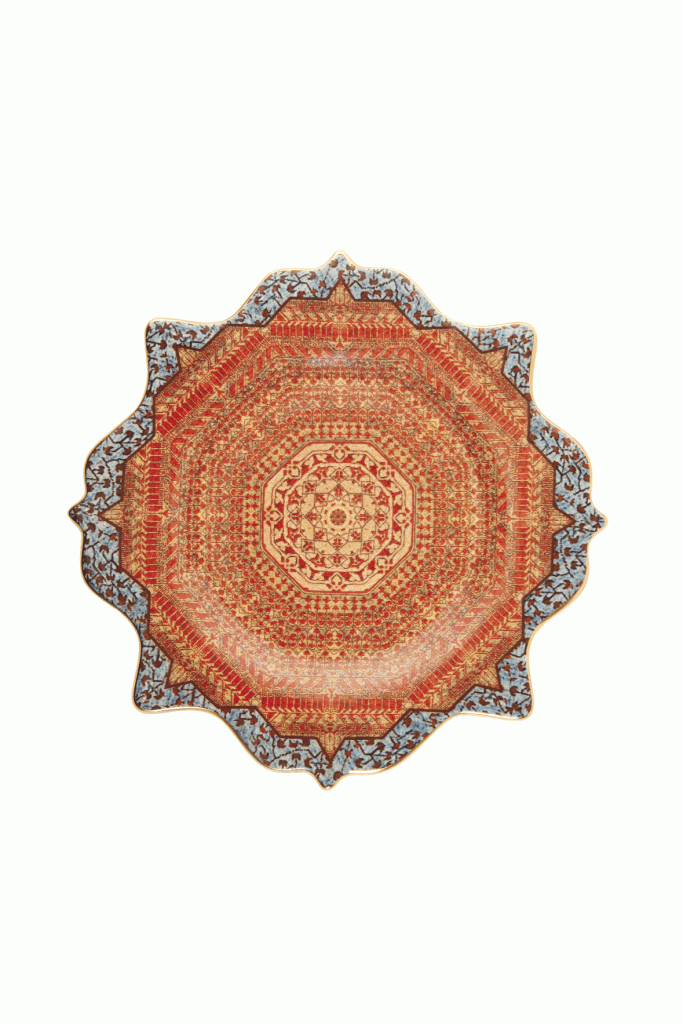 L’Object’s “Tabriz”  Dessert Plate. Edged in 14K gold, this earthenware plate brings rich pattern, shape, and color to your table when mixed with traditional china. Jeffrey Bannon, $65 (9-inch plate)