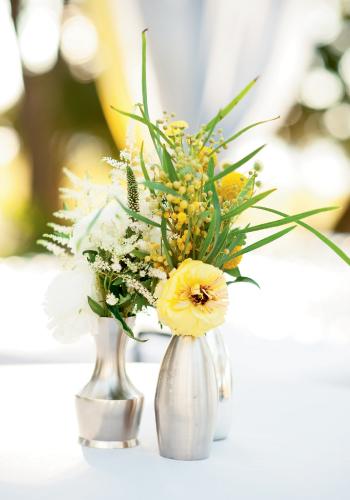 Wild Abandon: Wispy acacia and humble Astilbe toned down the formality of standout blooms, like this yellow lisianthus.