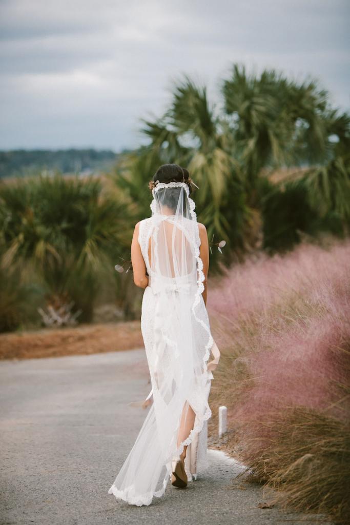 Bride&#039;s gown by Watters from Jean&#039;s Bridal. Veil from Bridal House of Charleston. Photograph by Mark Williams Studio at the Daniel Island Club.