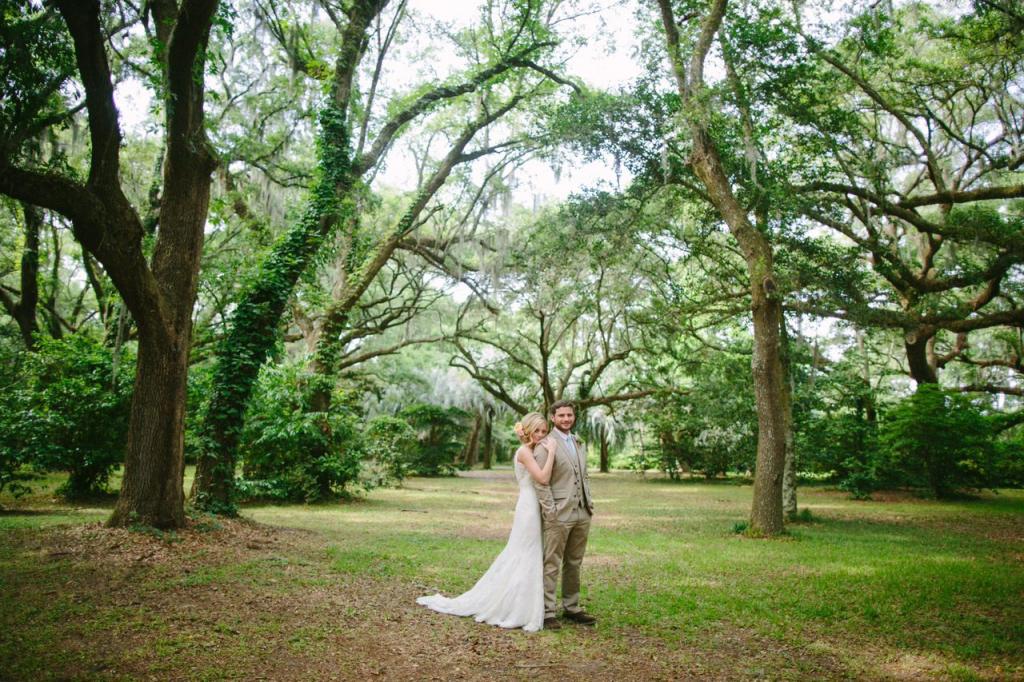 Bride&#039;s gown by Marisa Bridals. Menswear from Express. Photograph by Juliet Elizabeth at the Legare Waring House.