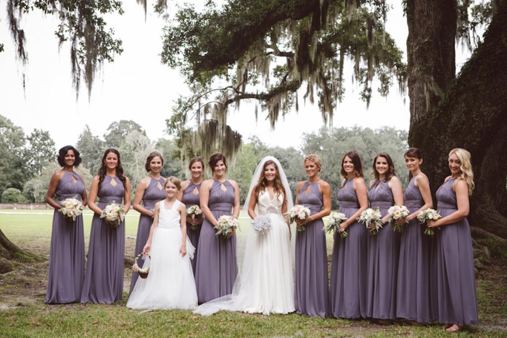 Bridesmaids’ dresses from Jean’s Bridal. Bride’s gown by Jenny Packham from White on Daniel Island. Florals by Fox Events. Image by amelia + dan photography at Middleton Place.