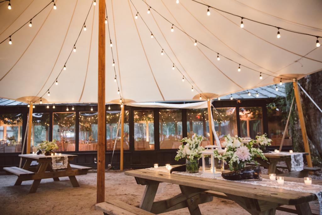 Tables from EventHaus. Tent by Sperry Tents Southeast.. Lighting by Innovative Event Services. Florals and wedding design by Fox Events. Image by amelia + dan photography.