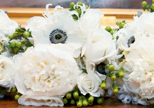 FLORABUNDANCE: Kimberly devoted most of her budget to standout blooms like these white anemone, hypericum, and roses.